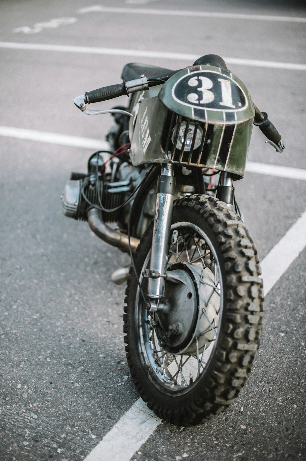 black and green motorcycle on road