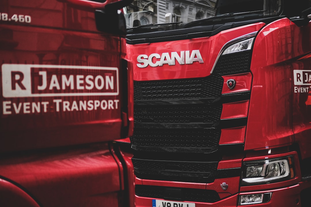 red and black coca cola truck