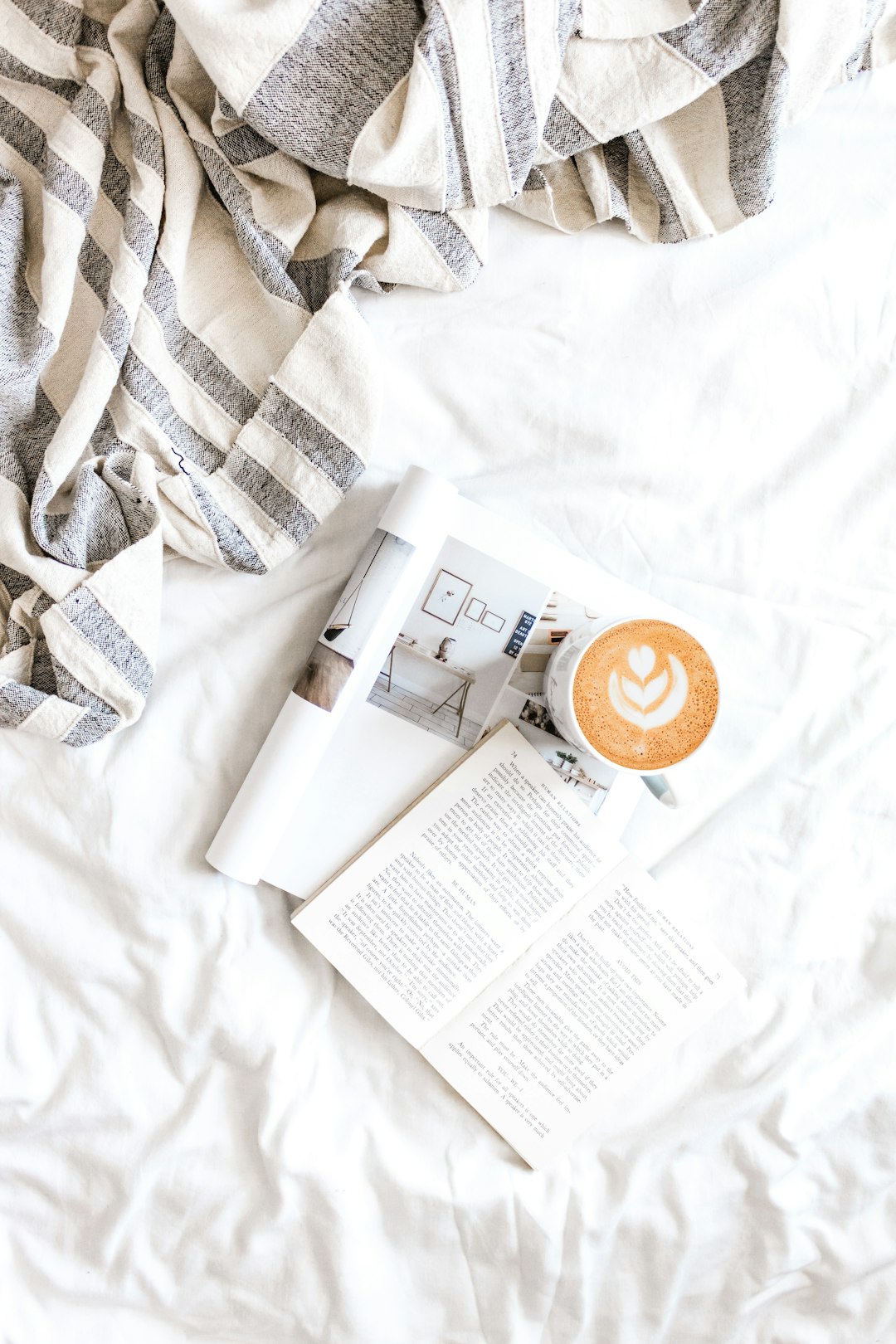 white ceramic mug on white table