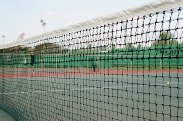 soccer goal net under blue sky during daytime