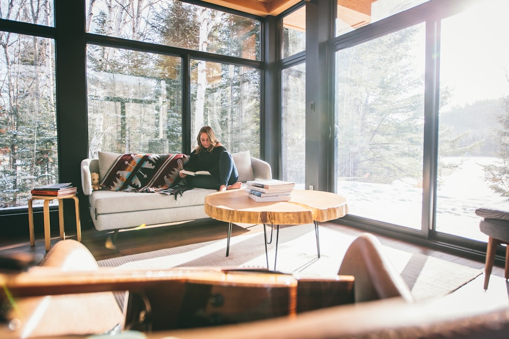 man and woman sitting on brown wooden chairs