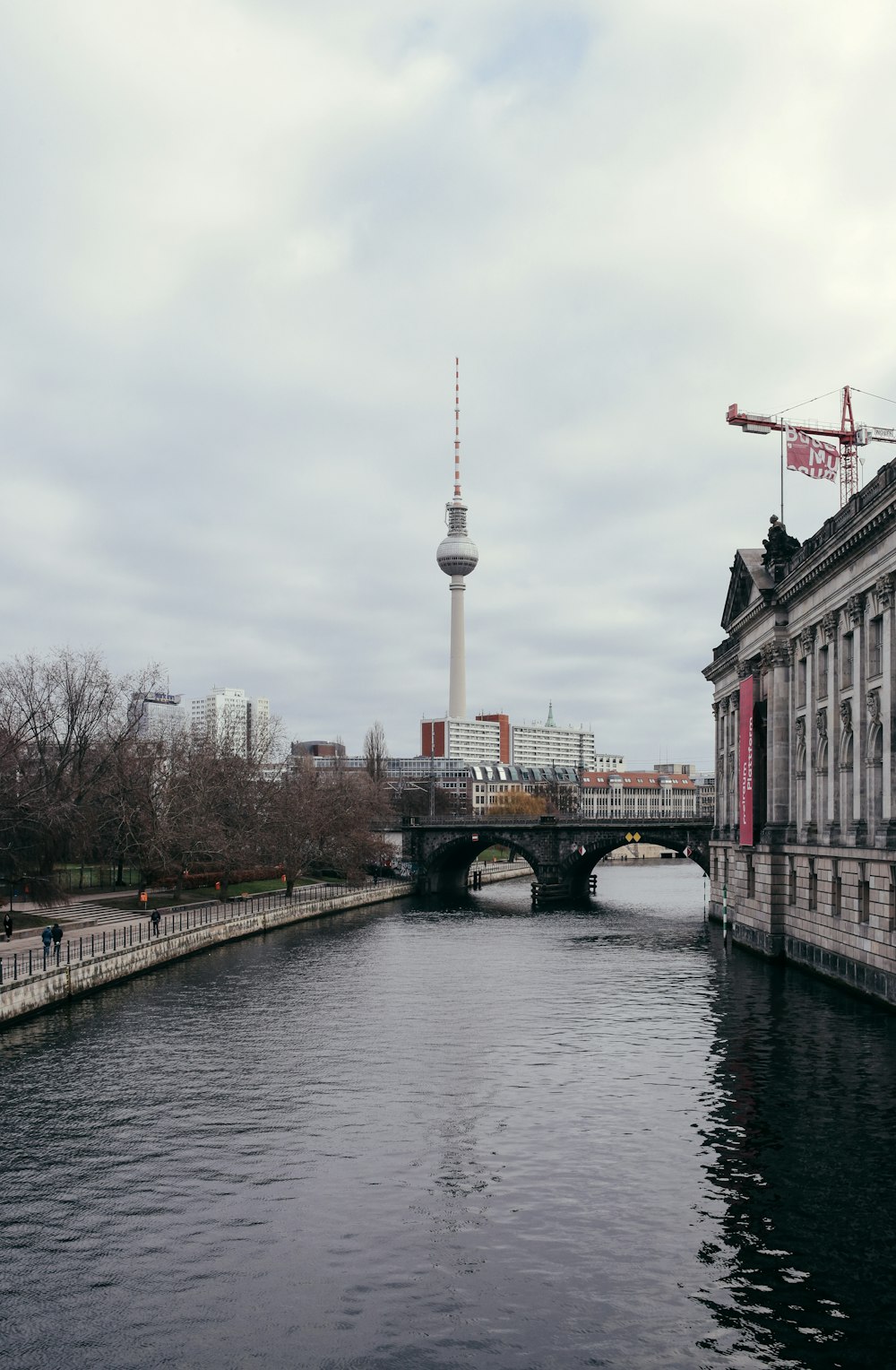 a river running through a city next to tall buildings