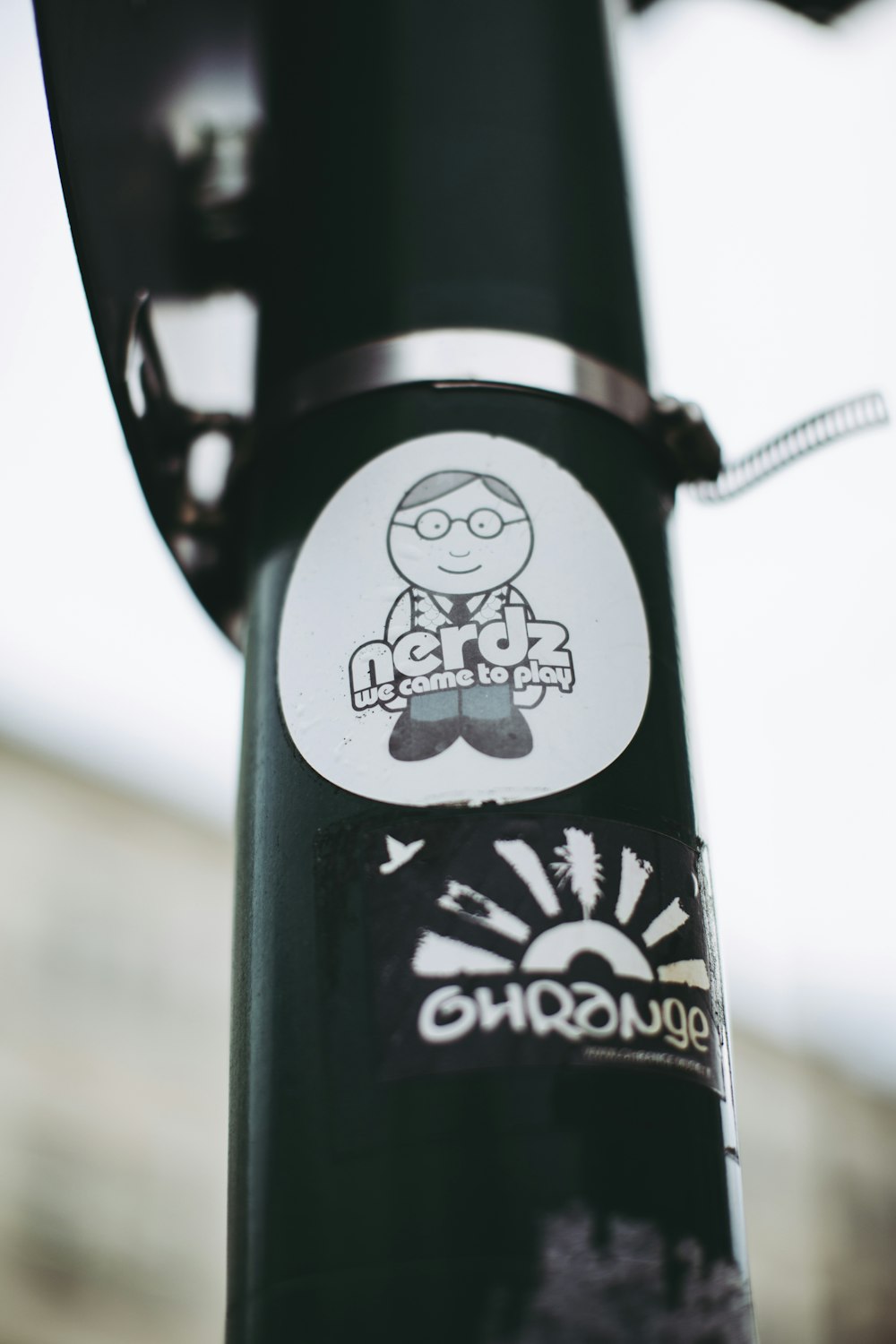 black and white bicycle with brown strap