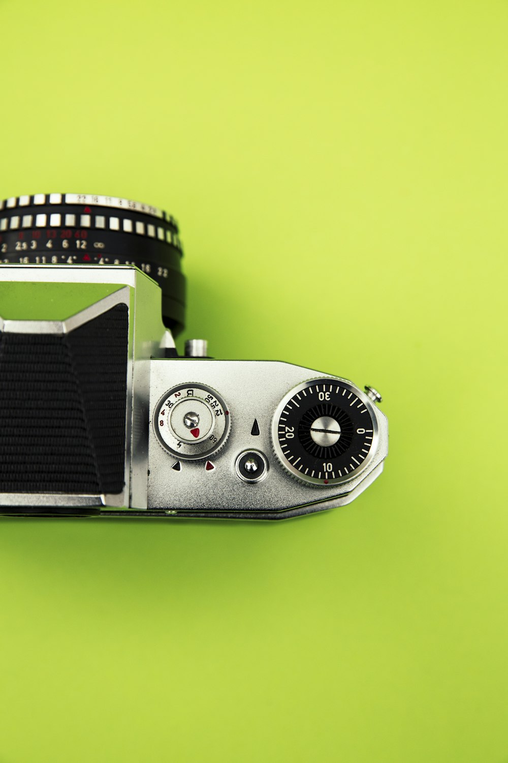 black and silver camera on green surface