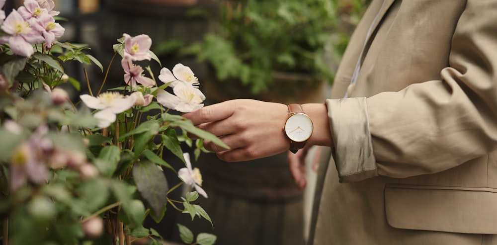 person holding white flower bouquet