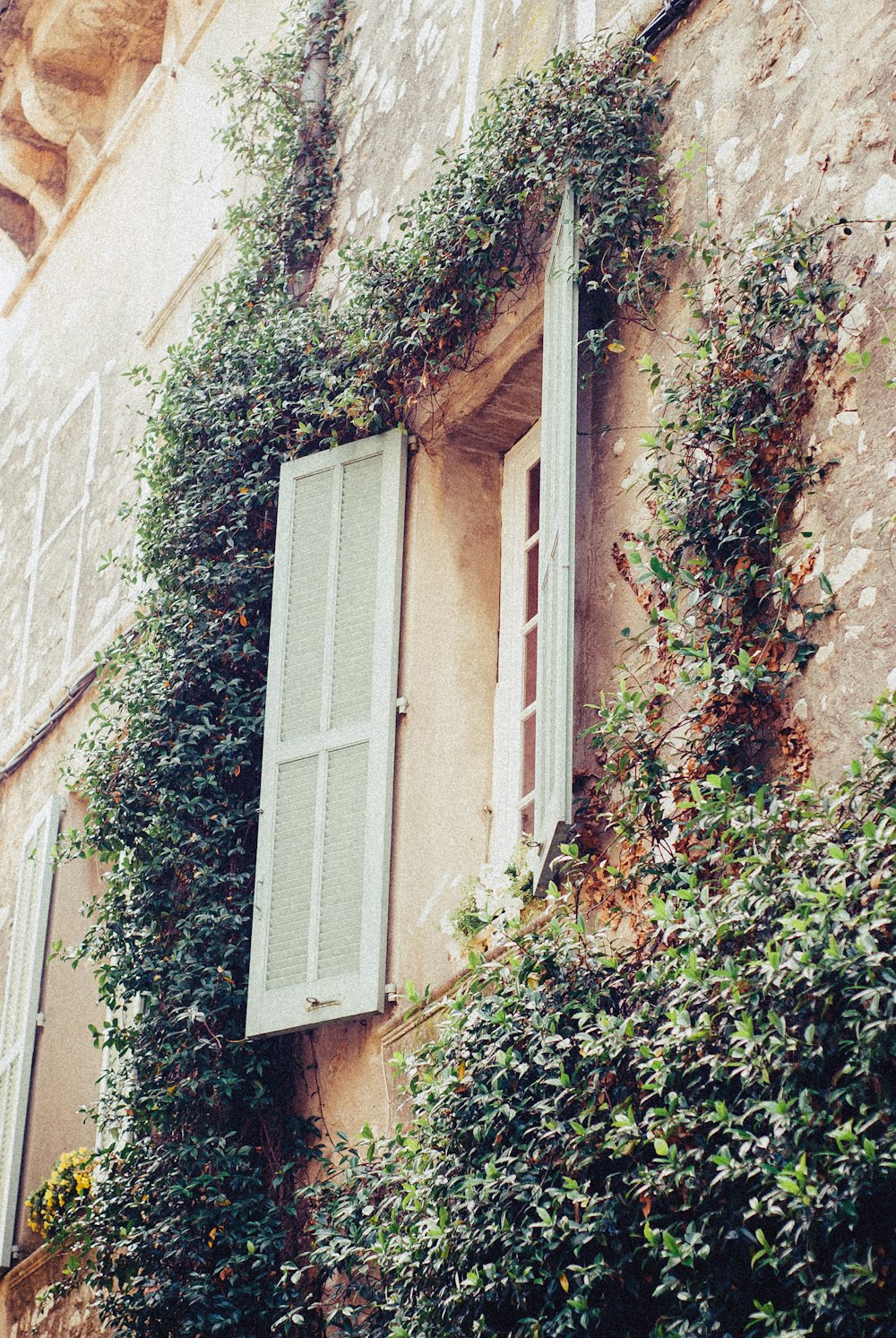 white wooden window frame on brown concrete wall