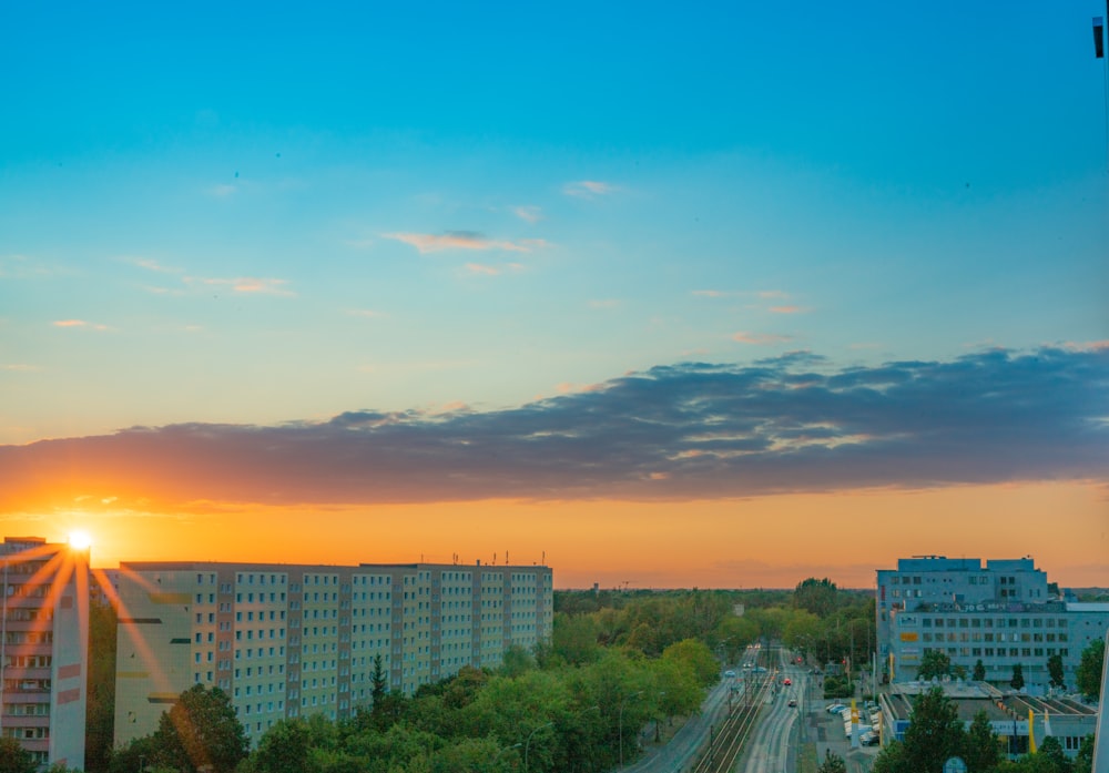 city buildings under blue sky during sunset