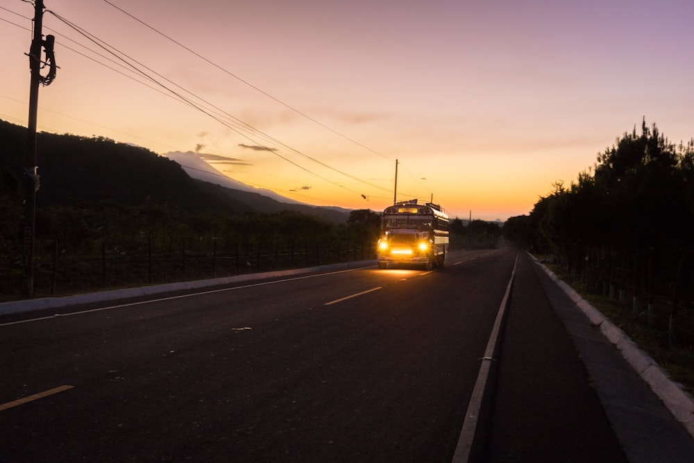 yellow truck on road during daytime