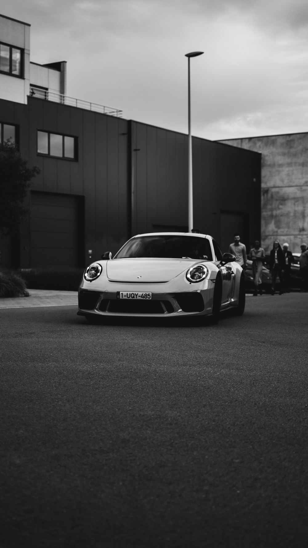 grayscale photo of white porsche 911