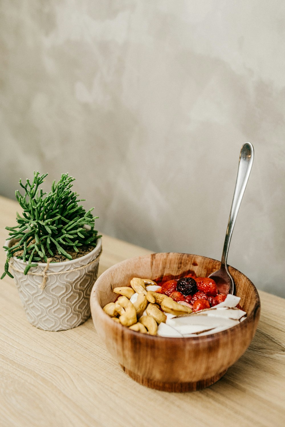 sliced banana and strawberry in white ceramic bowl