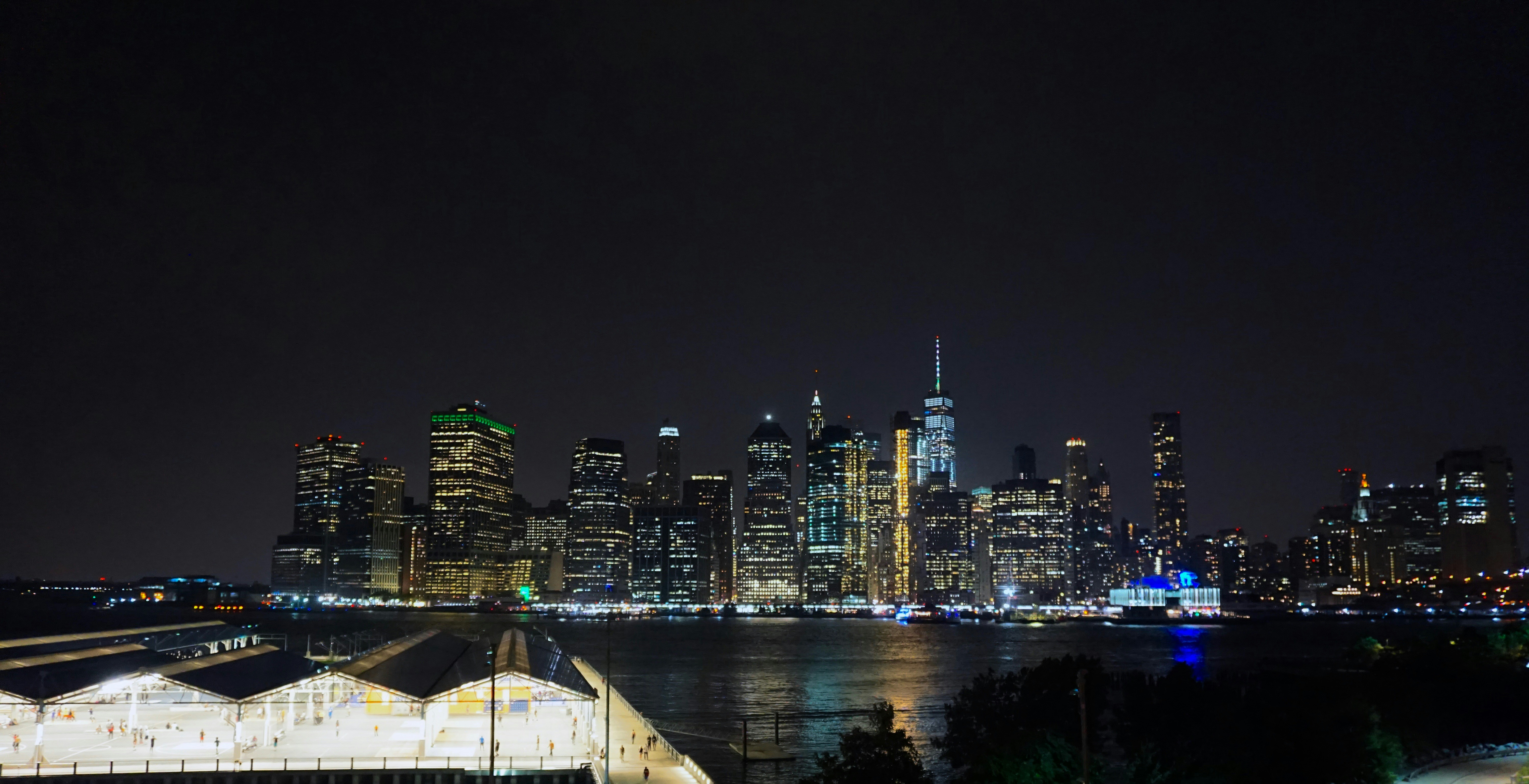 Manhattan skyline view and the Hudson River at night.