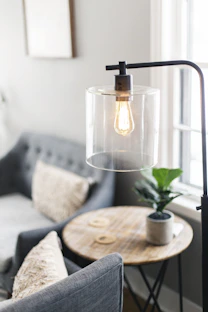 clear glass lamp on table