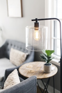 clear glass lamp on table