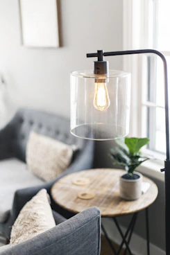 clear glass lamp on table