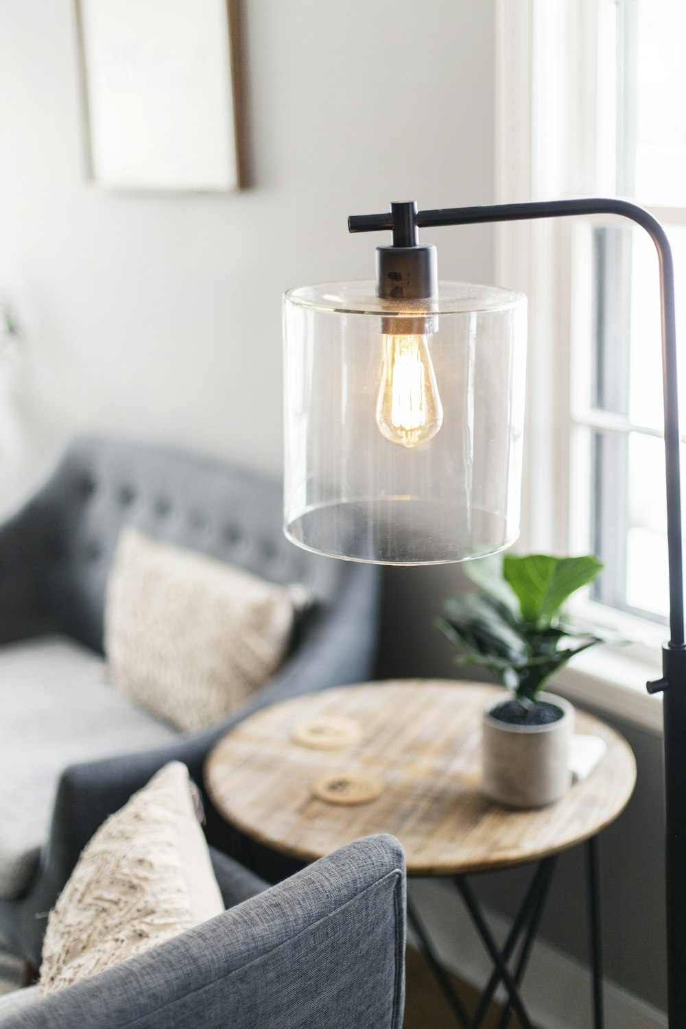 clear glass lamp on table