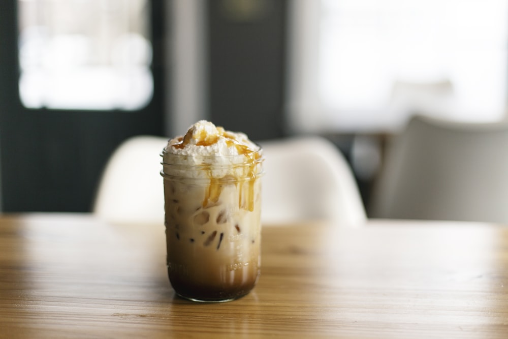 brown and white ice cream on brown wooden table