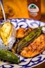 fried food on white and blue floral ceramic plate