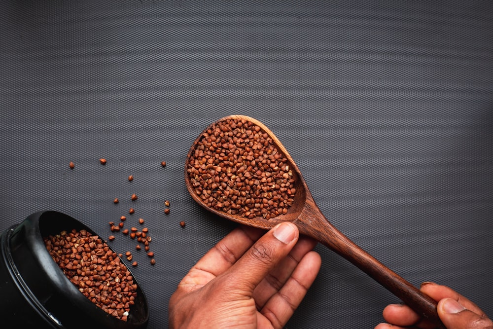 brown wooden spoon with brown powder