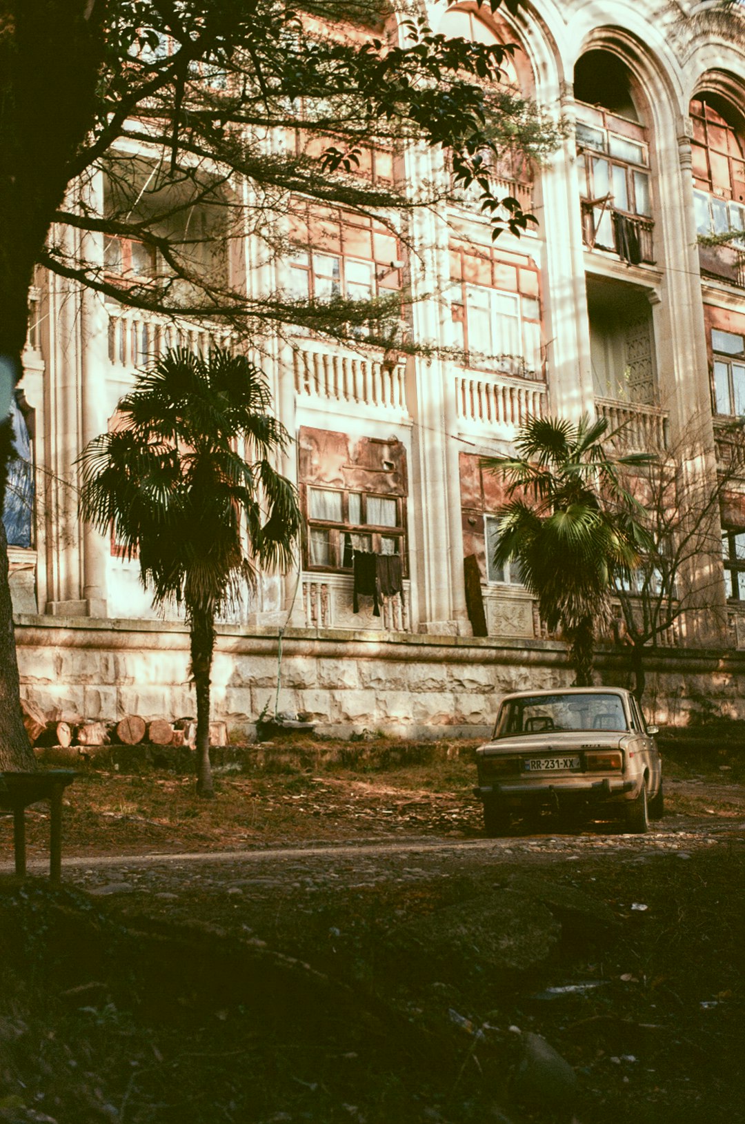 black car parked near white building