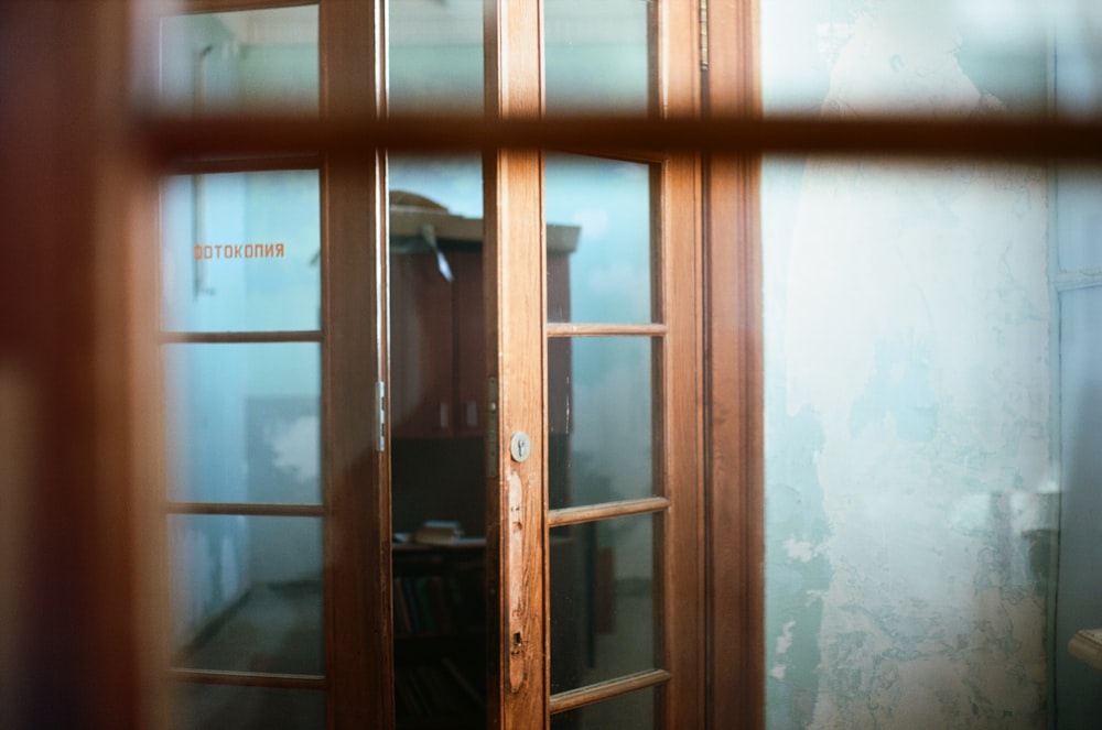 brown wooden framed glass door