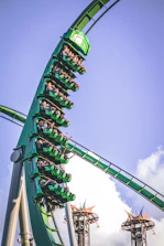A thrilling roller coaster ride at Universal Studios with excited visitors.