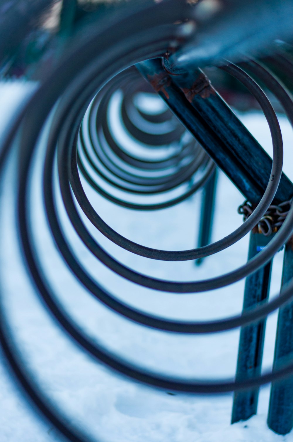 black metal spiral staircase in close up photography