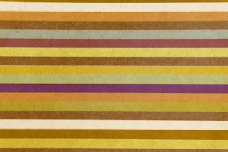 yellow red and white striped textile