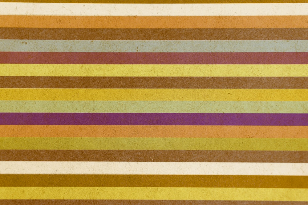 yellow red and white striped textile