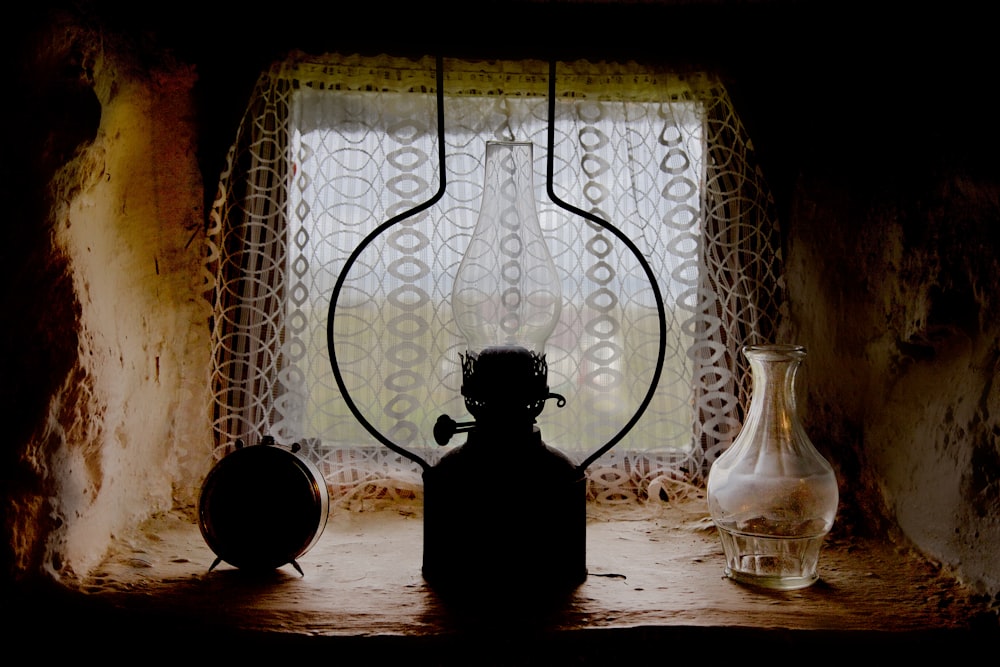 clear glass bottle beside clear glass bottle