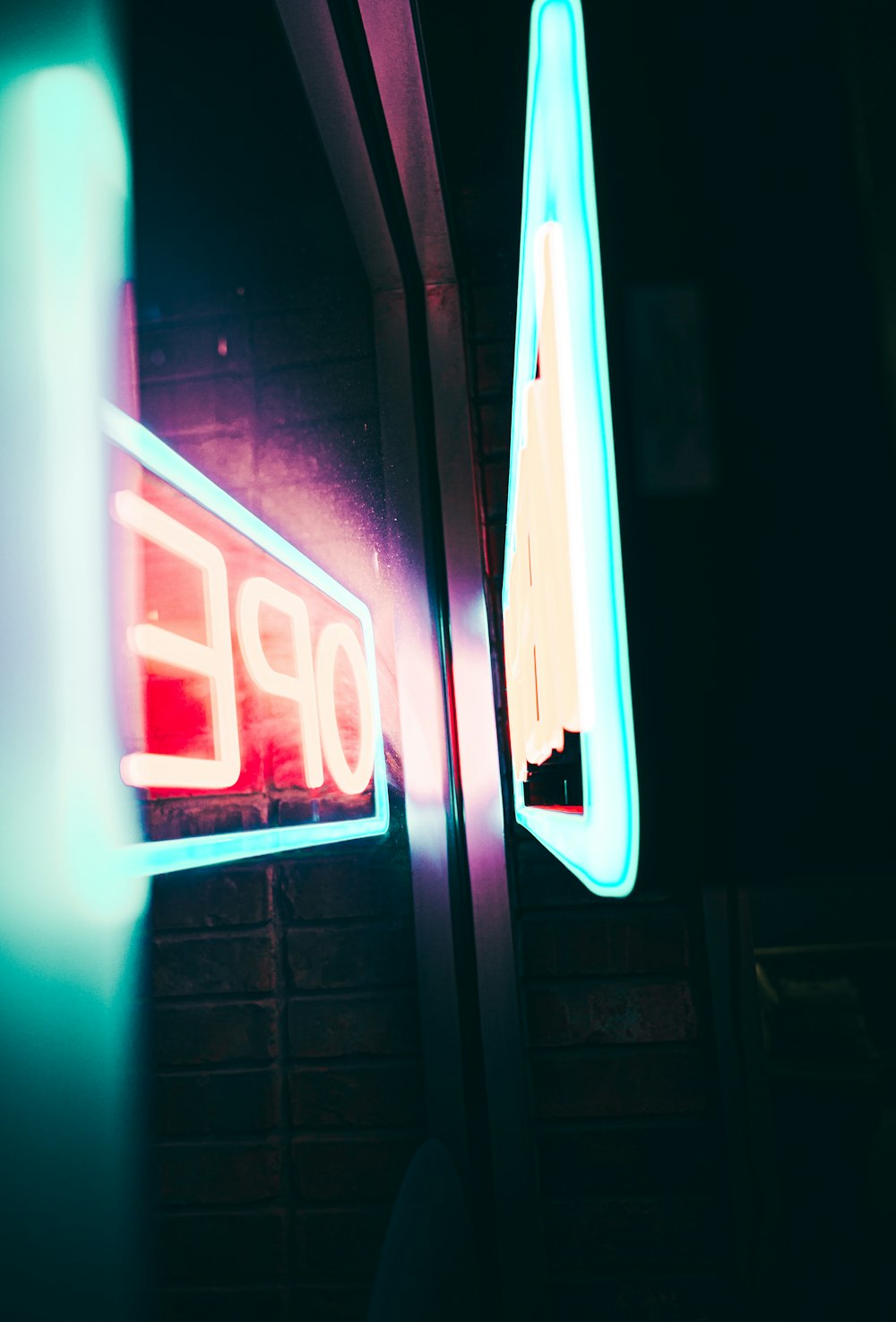 red and blue open neon sign