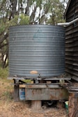 black round metal tank on brown wooden table
