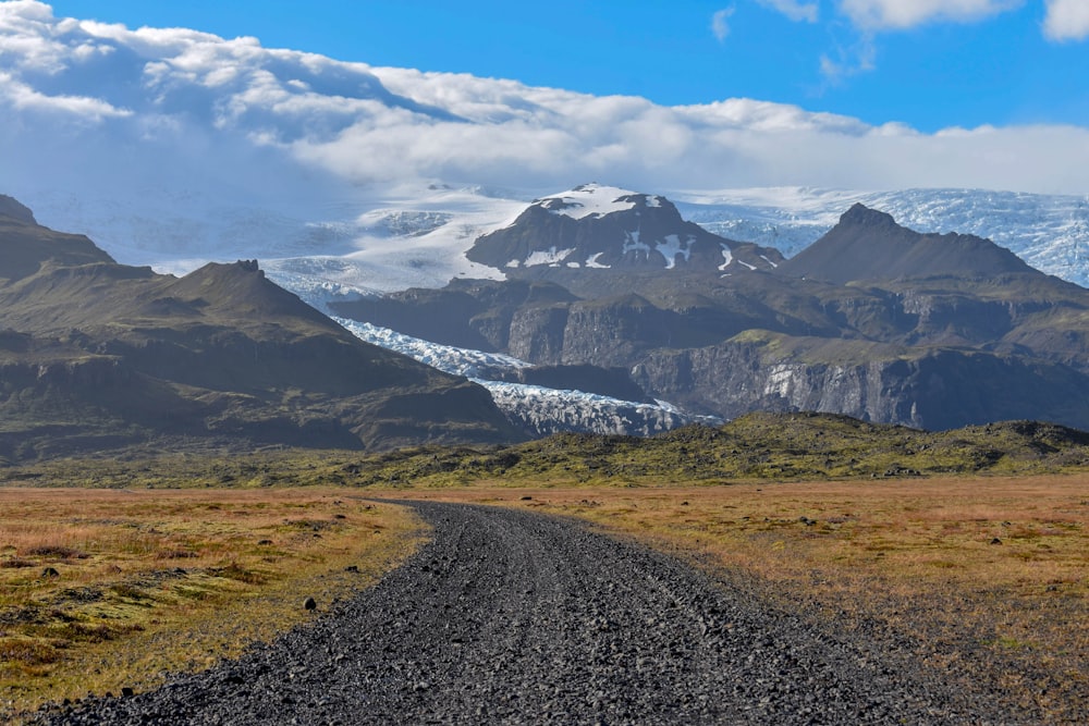 snow covered mountain under cloudy sky during daytime