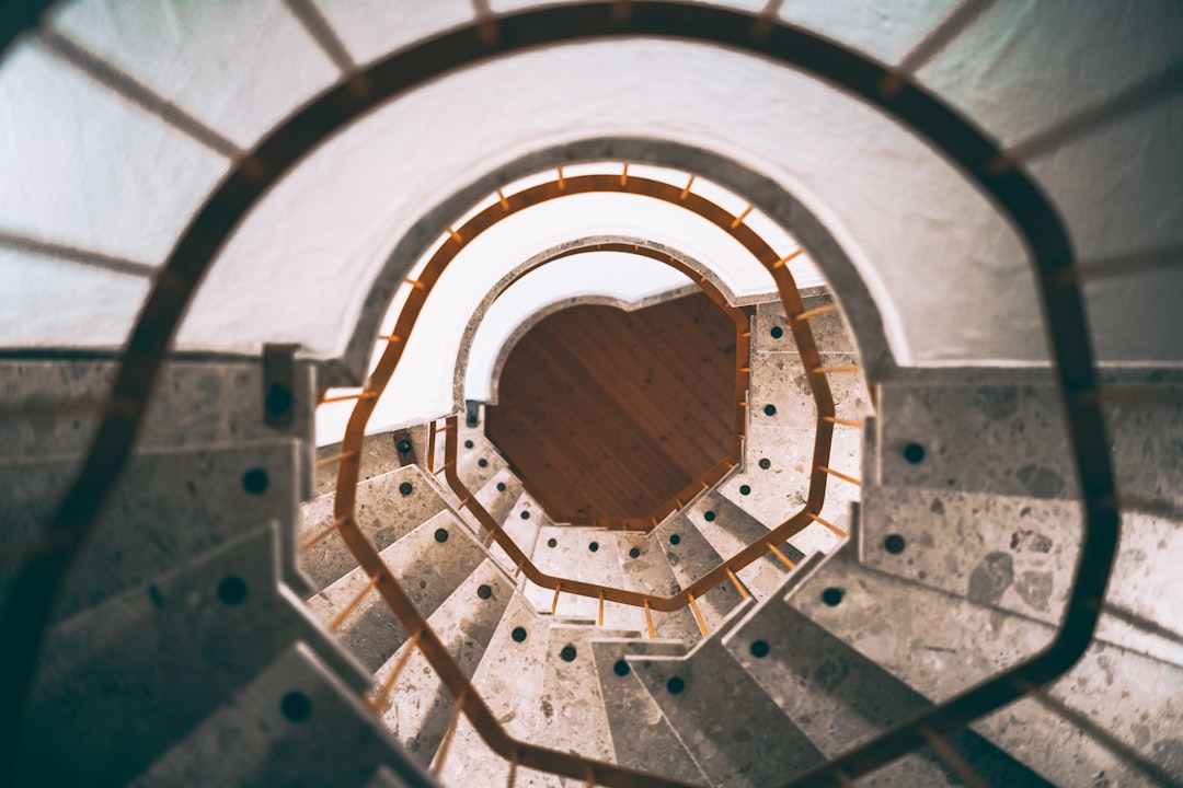 white and brown spiral staircase