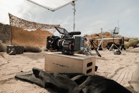 black dslr camera on brown cardboard box