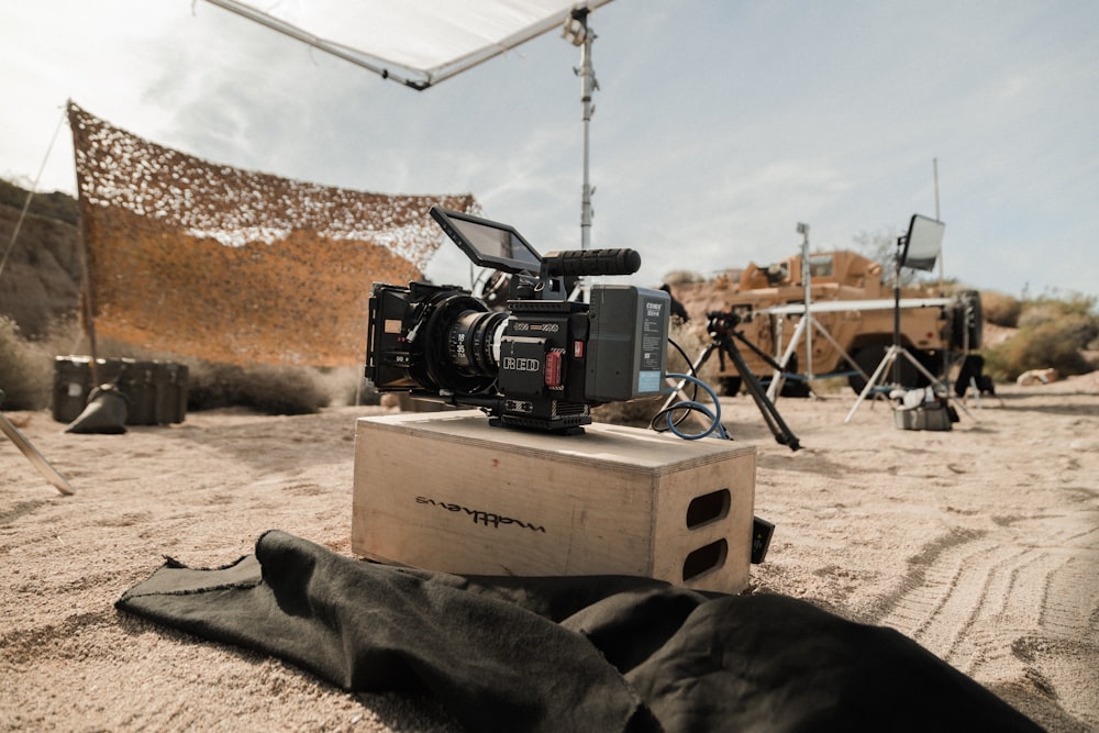 black dslr camera on brown cardboard box