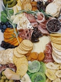 A vibrant charcuterie board filled with assorted cheeses and fruits.