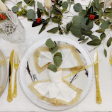 A festive table setting featuring valora's disposable cutlery and napkins in vibrant colors.