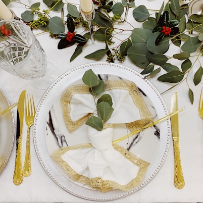 Packaged sets of disposable napkins with elegant gold highlights.