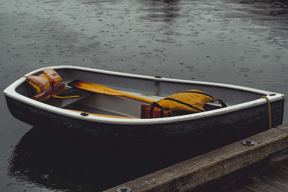 brown and white boat on body of water during daytime