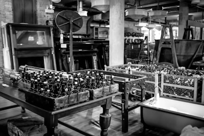 An inviting workspace filled with beer cans and memorabilia.