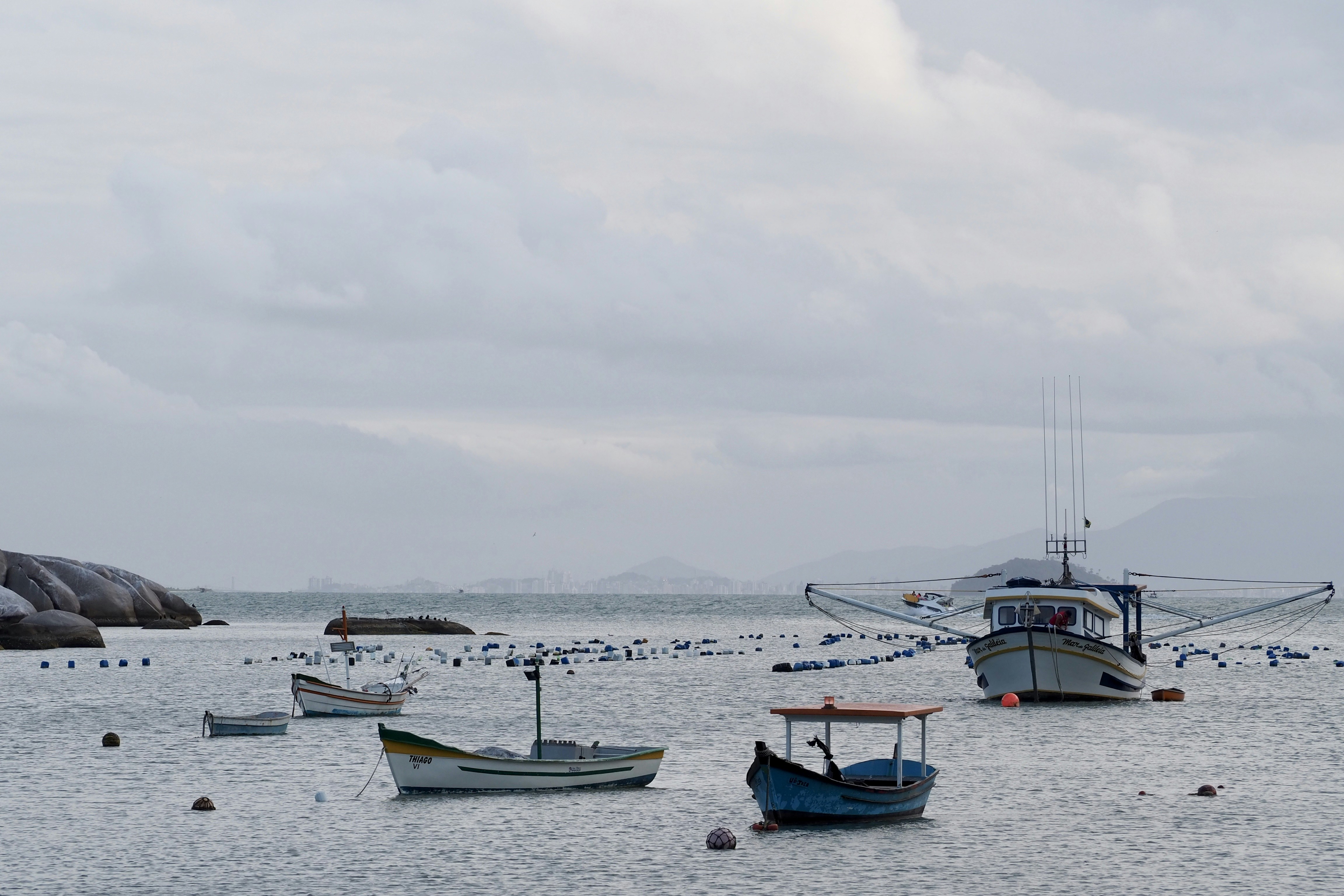 Small ship and boats on a cloudy day in Santa Catarina