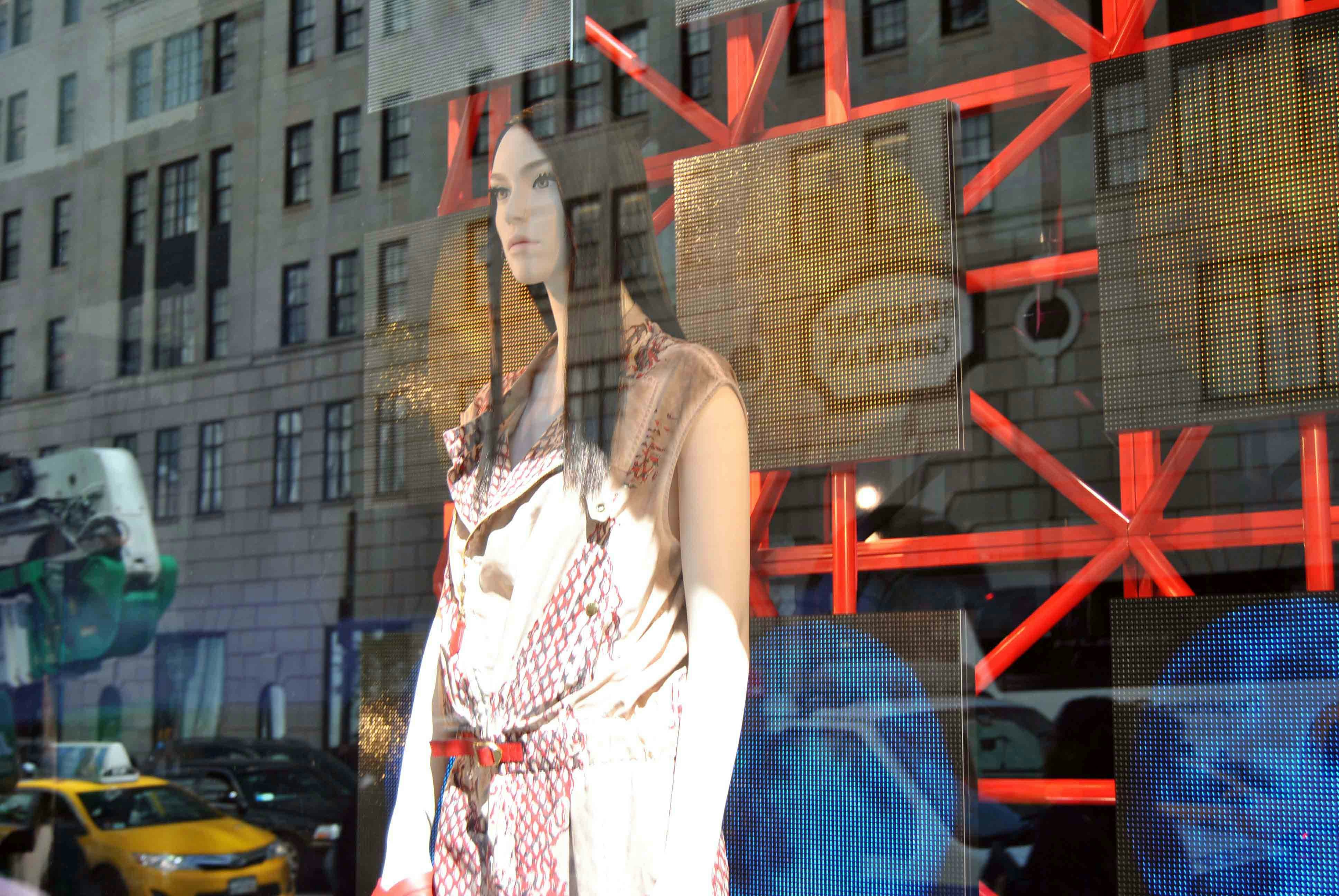 woman in white and red floral sleeveless dress standing near red metal ladder