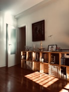 brown wooden cabinet near white wall