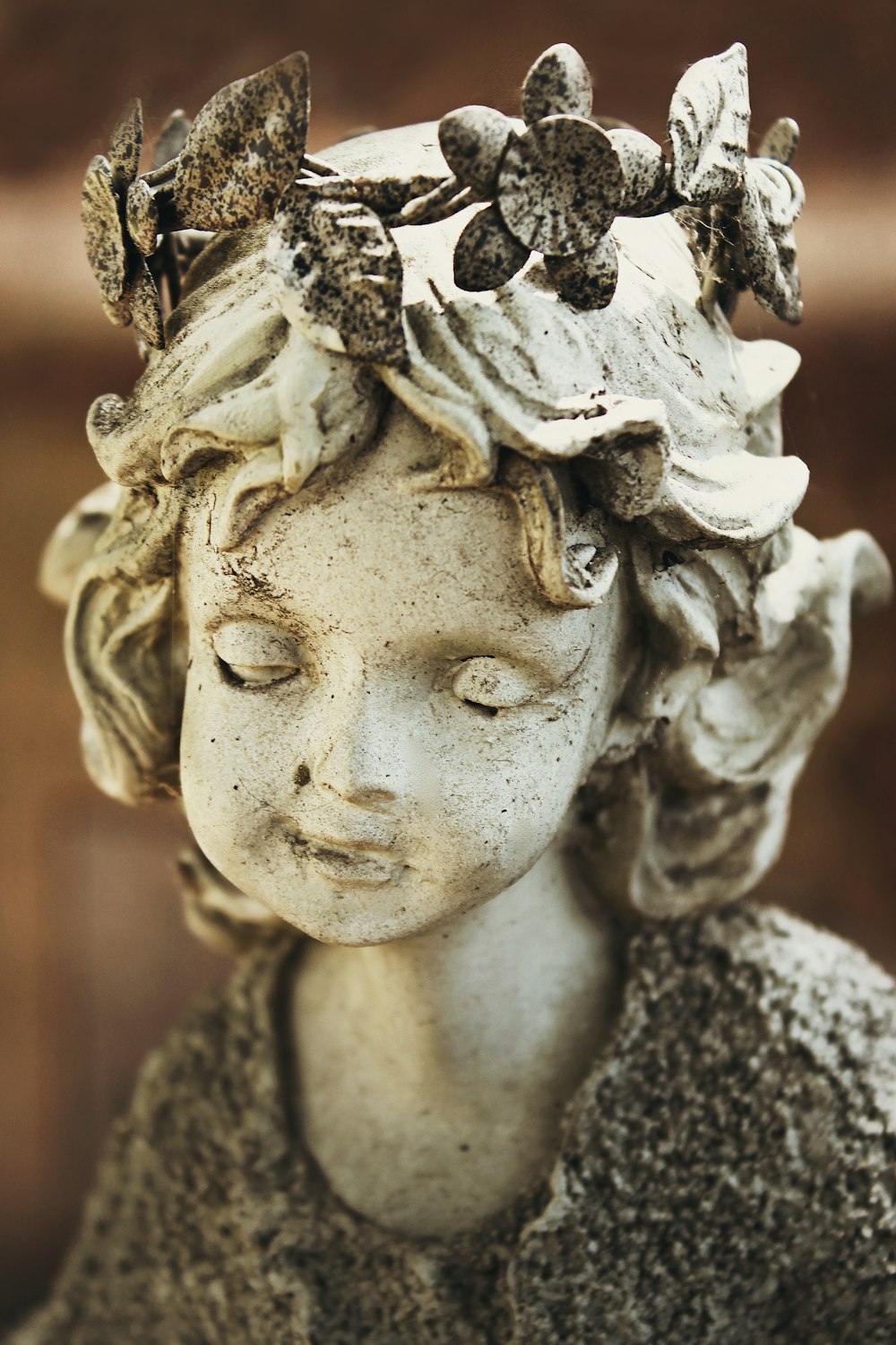 womans face with white and black floral headdress