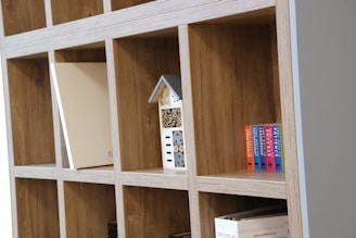 Contemporary wooden shelving unit with open and closed storage.
