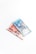 Two banknotes, one valued at 100 and the other at 50, featuring images of animals, are placed on a white surface. The notes are intricately designed with vibrant colors and details.