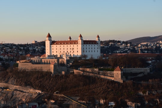 white and brown concrete building in Bratislava Castle Slovakia