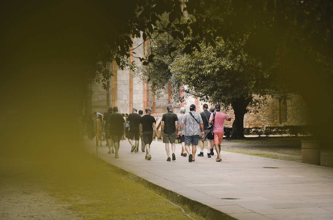 people walking on sidewalk during daytime