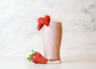 strawberry shake in clear drinking glass