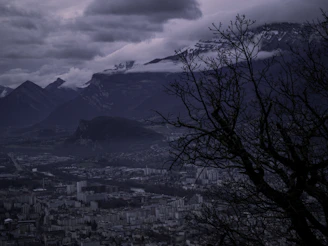 A dark, atmospheric map showing the five core cities connected by winding roads and marked with symbolic glyphs.